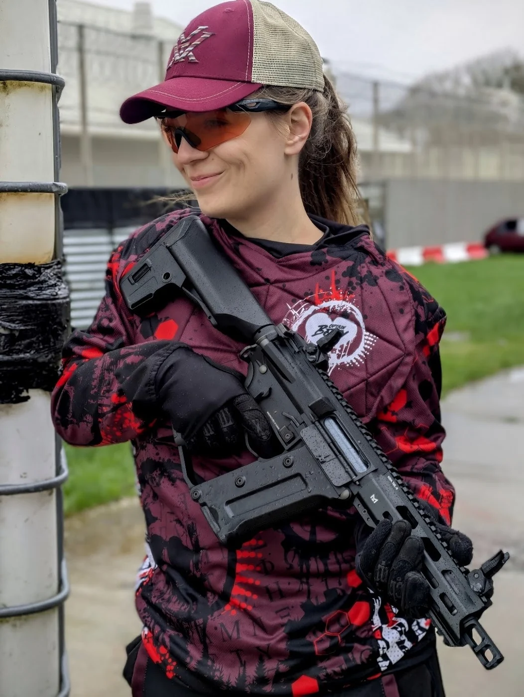 Betty wearing a red and black custom SlideFirePro jersey