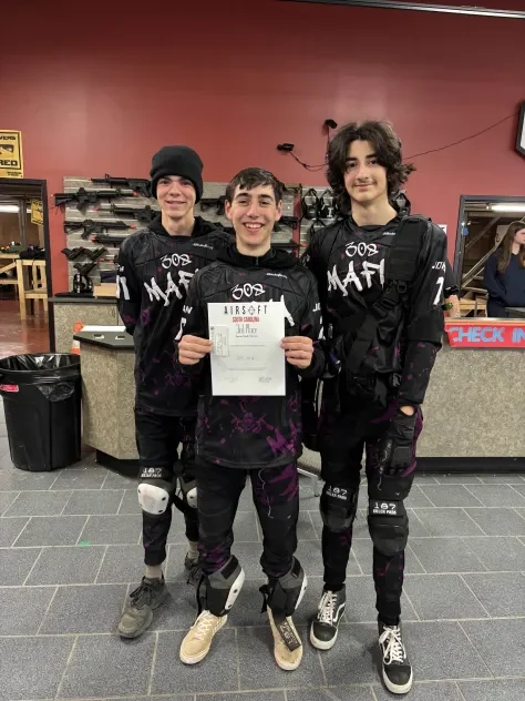 308 Mafia players in their custom jerseys at an event